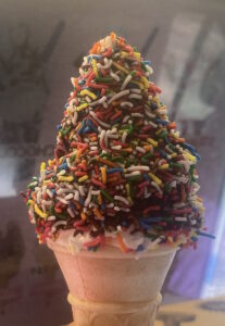 Ice cream cone with tens & thousands topping
